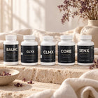 Premium Stack bottles on travertine and cream linen in morning light